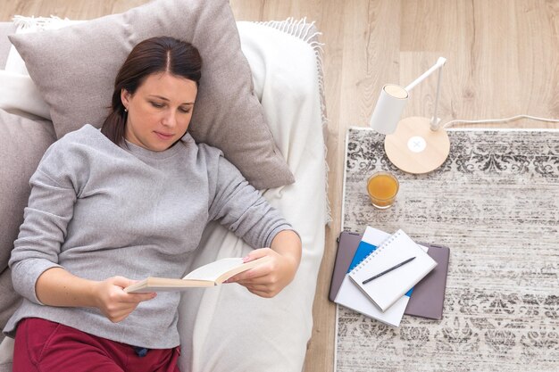 Woman using mobile phone at home