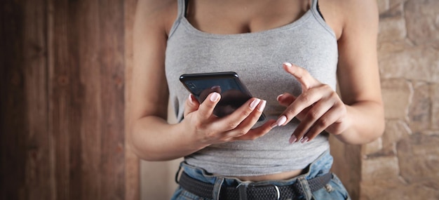 Woman using mobile phone at home