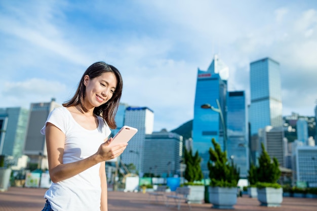 Woman using mobile phone at outdoor