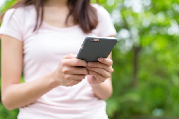 Woman using mobile texting messages