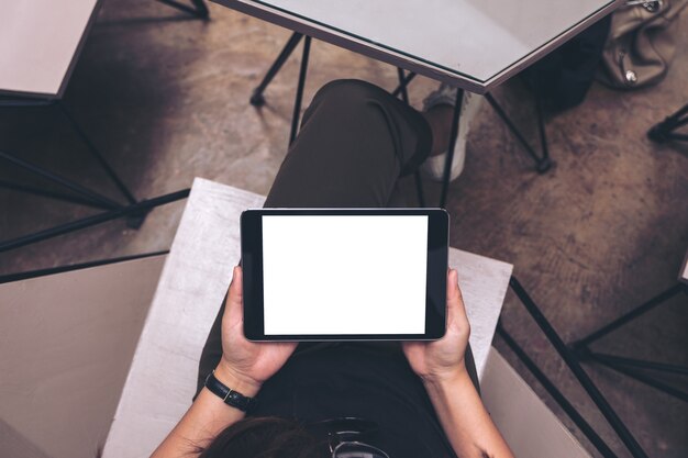 Woman using mockup tablet