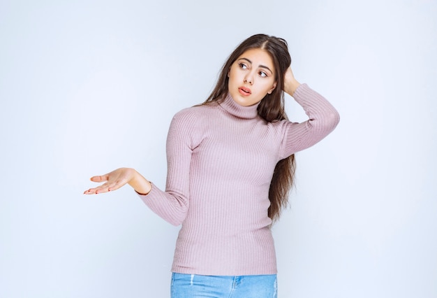 woman using open hand to present something or to give explanation.