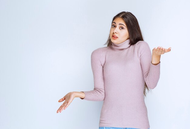 woman using open hand to present something or to give explanation.