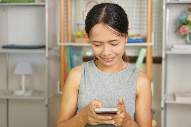 woman using phone to shop online