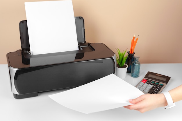 Woman using the printer to scanning and printing document