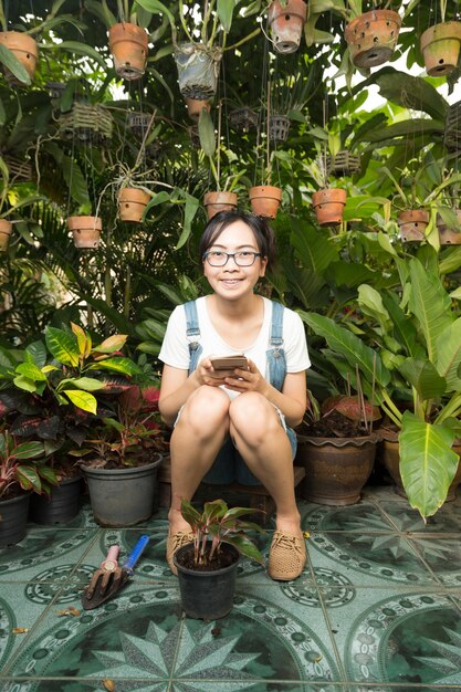 Woman using smart phones in the house