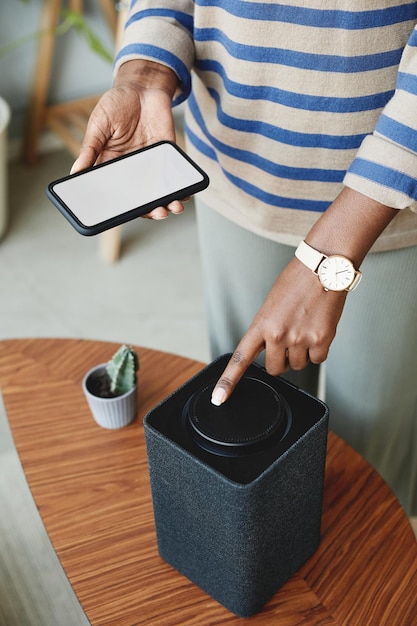 Woman using Smart Speaker Closeup