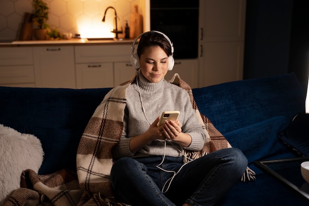 Photo woman using smartphone as a habit