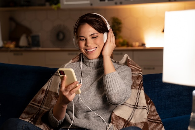 Photo woman using smartphone as a habit