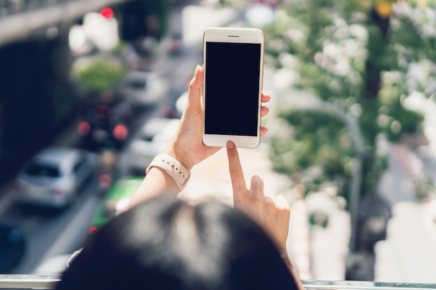 Woman using smartphone, During leisure time. The concept of using the phone.