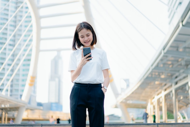 Woman using smartphone, During leisure time. 