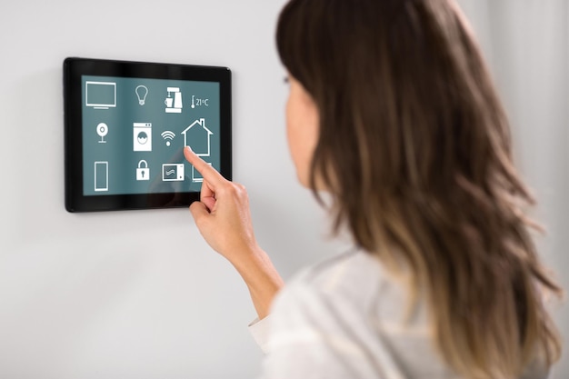 woman using tablet computer at smart home