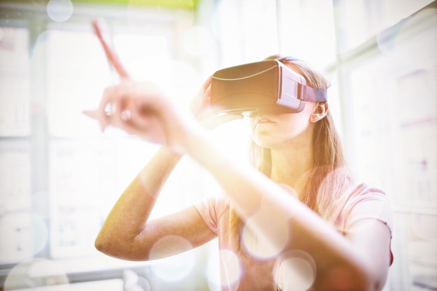 Woman using a virtual reality device in the office