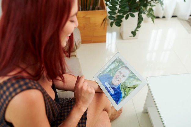 Woman video calling her grandfather