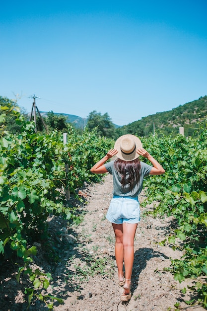 Woman in the vineyard in sun day