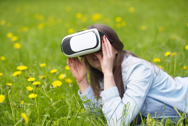 Woman in virtual reality headset outdoors