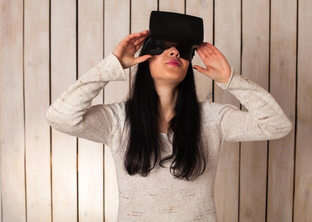 Woman in virtual reality helmet. VR glasses.