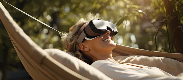 Woman in vr glasses playing game in hammock outdoors