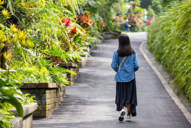 Woman walk along the garden