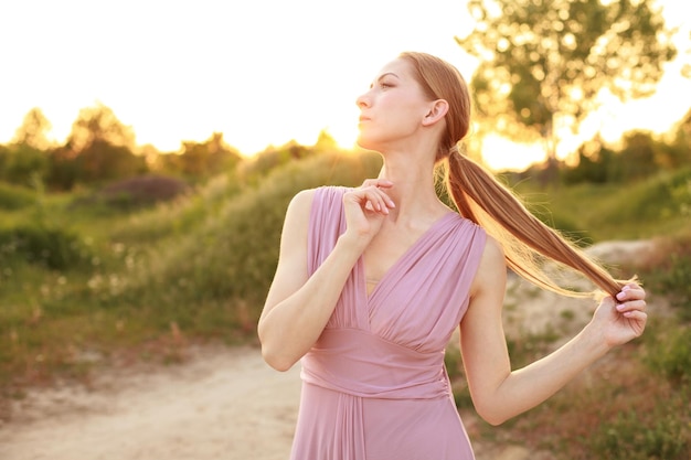 A woman on a walk in the summer sensual