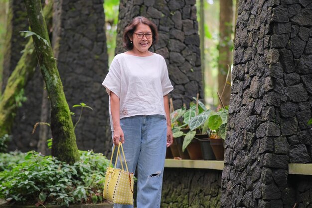 Woman walking alone in the shady park