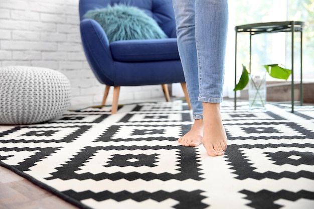 Woman walking on carpet at home