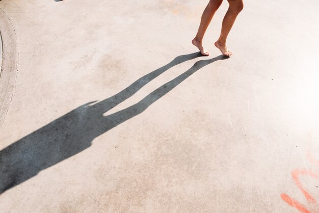 Woman walking on a cement floor