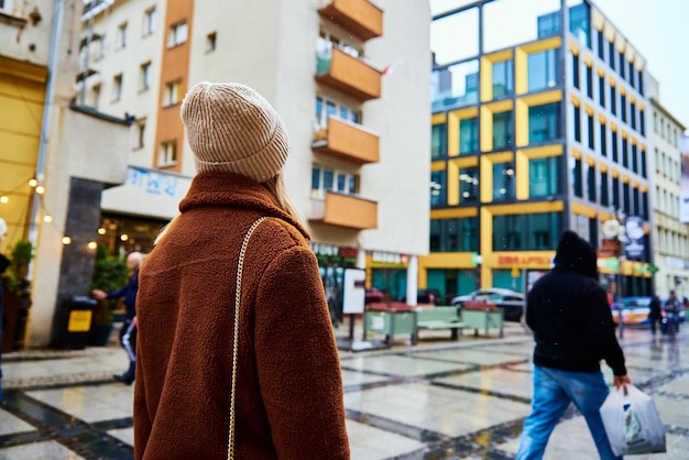 Woman walking at city street