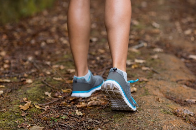 Woman walking in dirt track