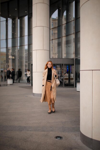 woman walking down the street. walk through the autumn city