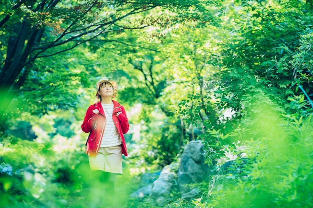 Woman walking in the fresh green mountain