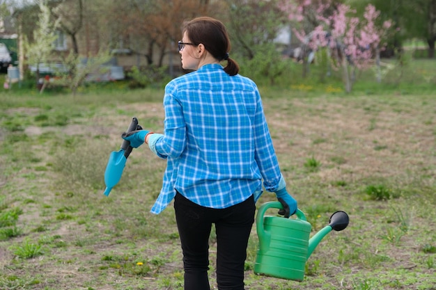 Woman walking in garden in spring season