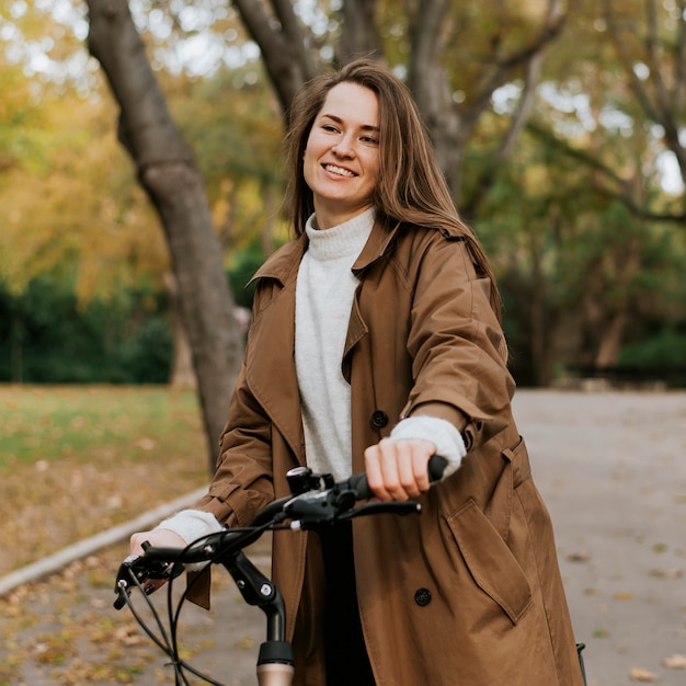woman walking next to her bicycle