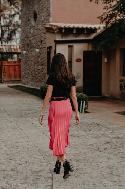 Woman walking in a little town