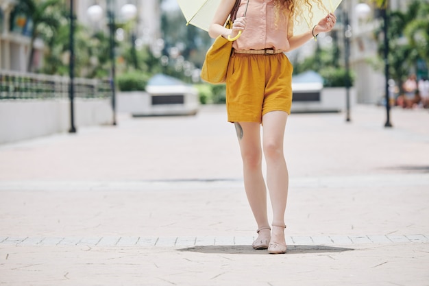 Woman walking on pavement