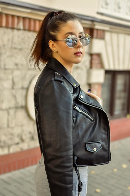 woman walking trough the street of city