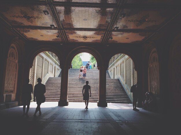 Woman walking in tunnel