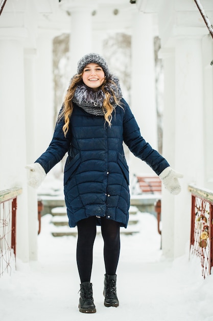 Woman walking in winter park