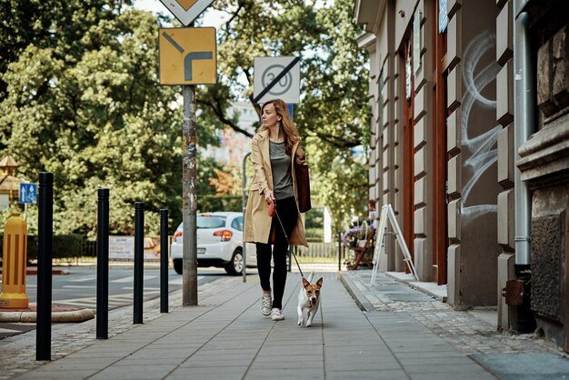 Woman walks with dog