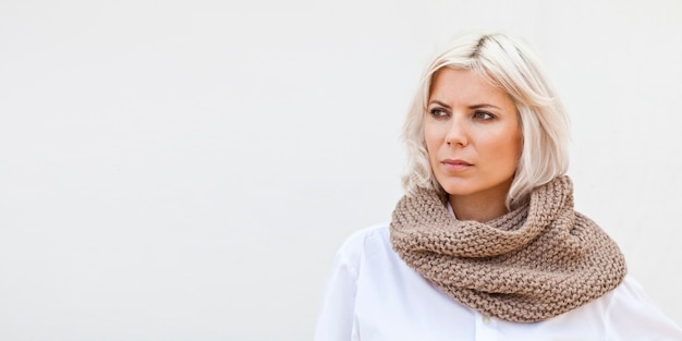 Woman in warm beige wool knitted snood