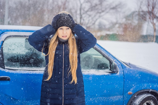 The woman was very froze in winter under snowfall Winter problems