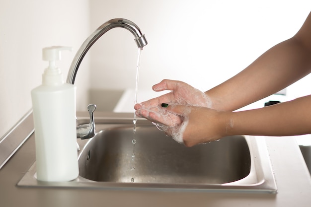 Woman washing hand for corona virus prevention Washing Hands stop spreading coronavirus