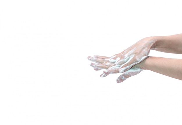 Woman washing hand with soap foam and water.