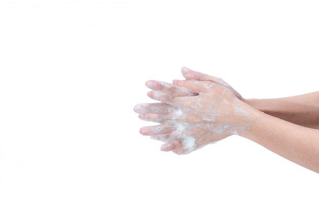 Woman washing hand with soap foam and water.