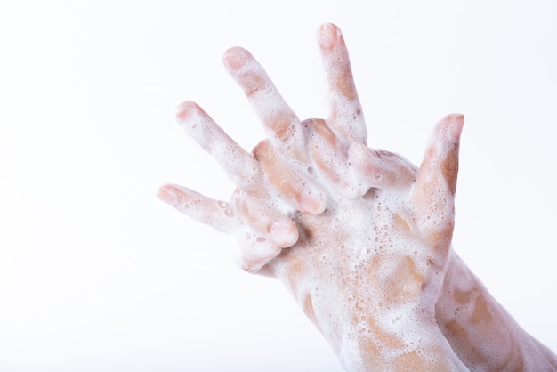 Woman washing hands with soapd. Healthcare  concept.