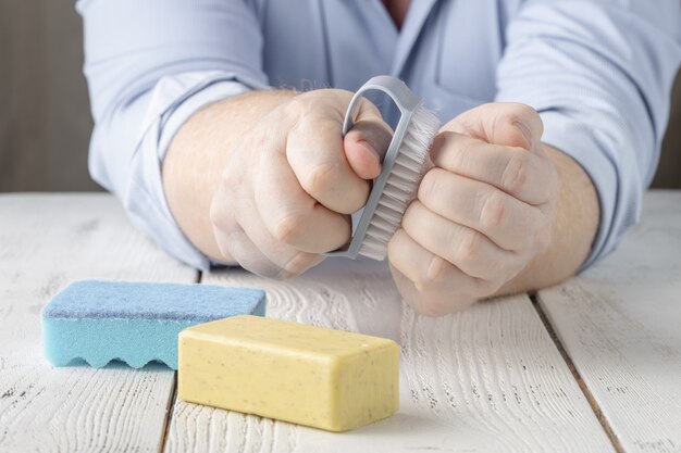 Photo woman washing her hands with soap bar and cleaning brush