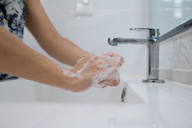 Woman washing her hands