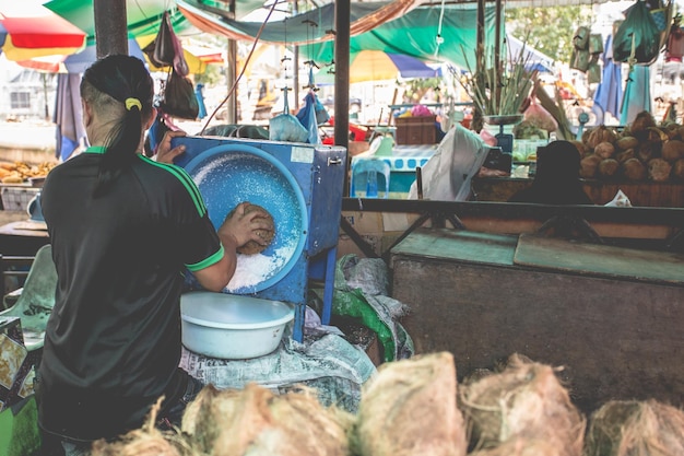 Woman washing up in a local market in Asia.