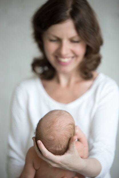 Woman watching her baby