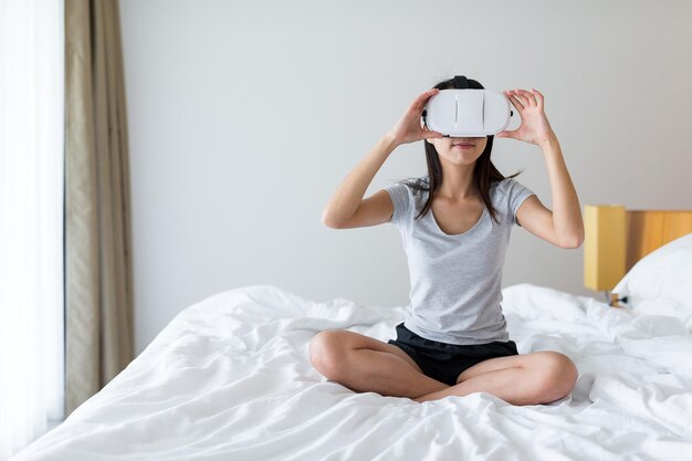 Woman watching with virtual reality device at home